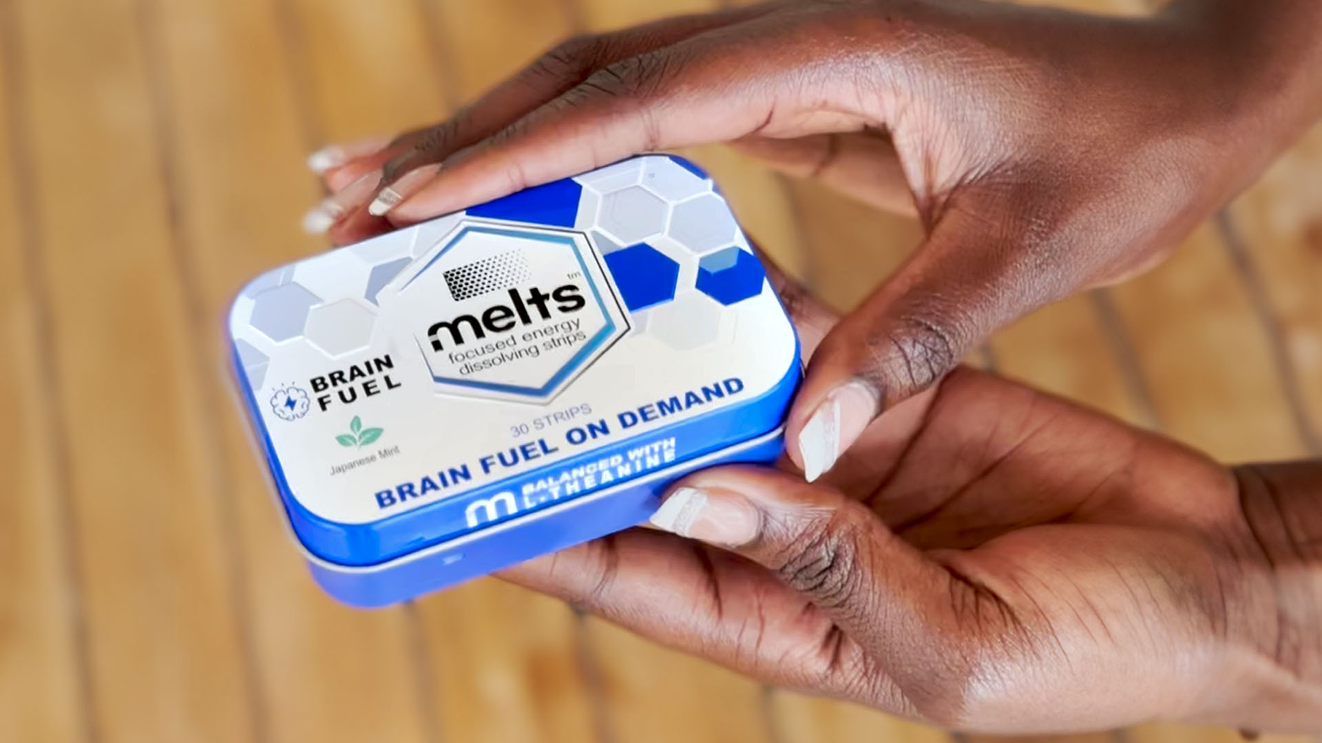 Person Holding a Brain Fuel Tin